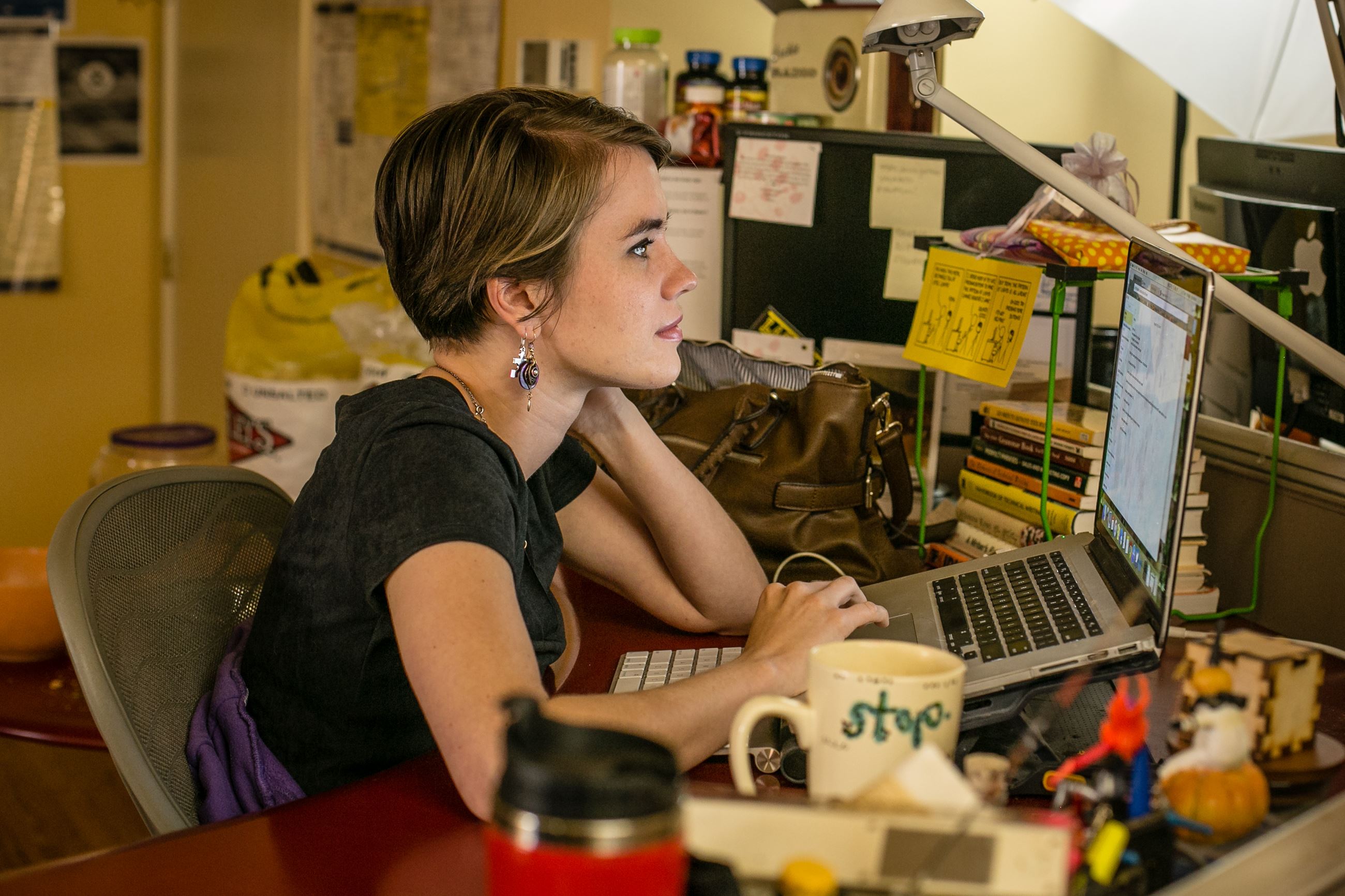 Woman using a laptop at her desk